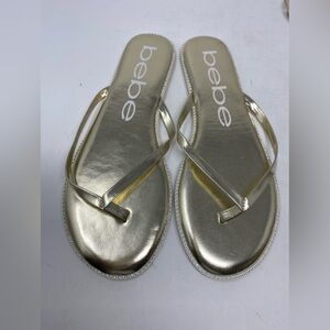 Women's bebe 𝐈𝐥𝐞𝐚𝐧𝐚 Gold  thong sandals